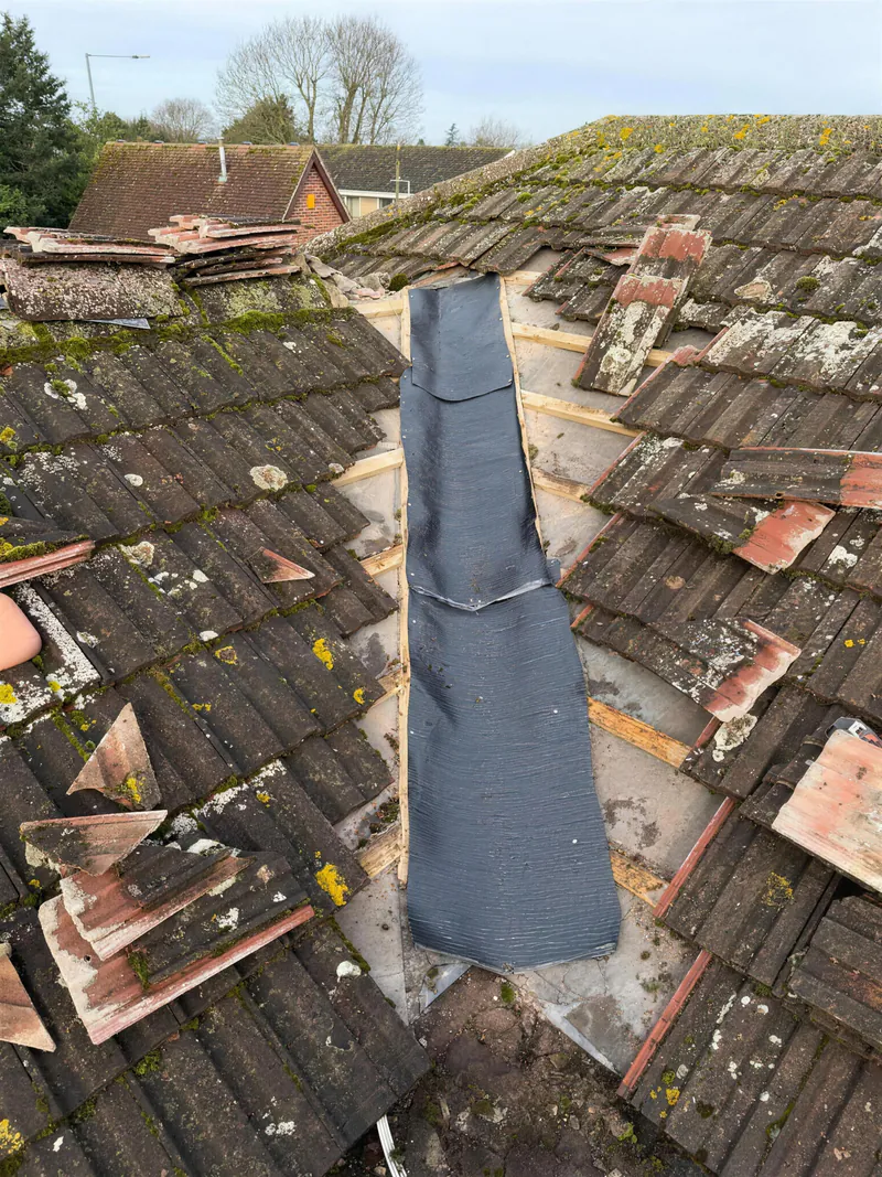 Old valley stripped out with a new lining laid on a tiled roof
